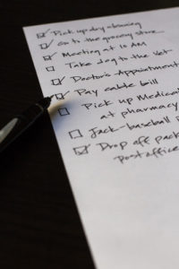 Closeup image of to-do list with boxes checked