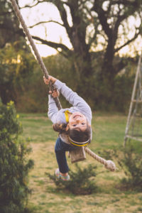 Image of girl on simple rope swing