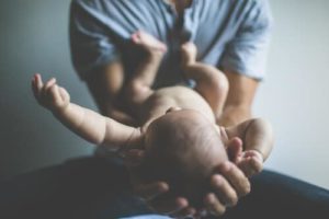 Image of man holding baby