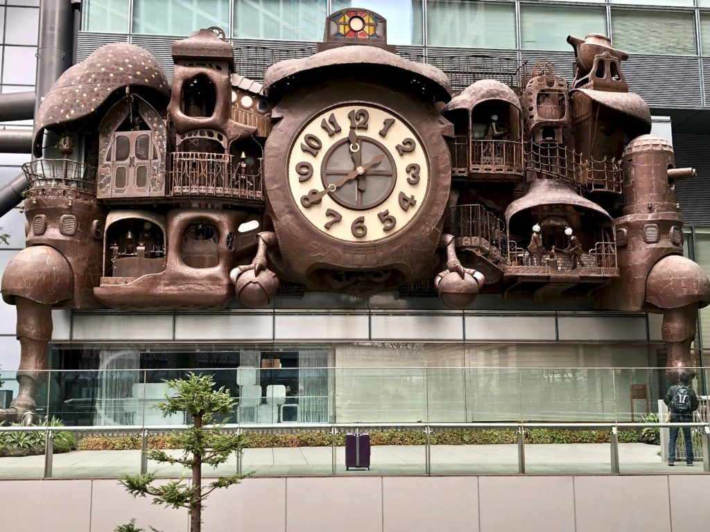 Giant Ghibli Clock in Tokyo, steampunk themed, copper & steel, 3 storeys high, by anime film director, Hayao Miyazaki