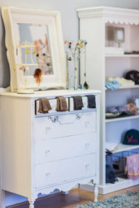 White painted chest of drawers with mirror, jewellery and socks