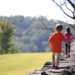 Image of children walking on stone wall