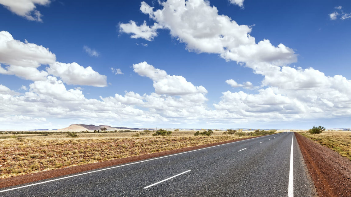 Image of road through flat dry landscape