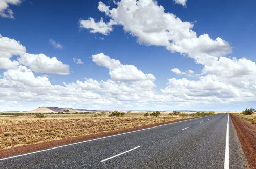 Image of road through flat dry landscape