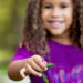 Image of girl with purple flower