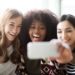 Three young women take a selfie