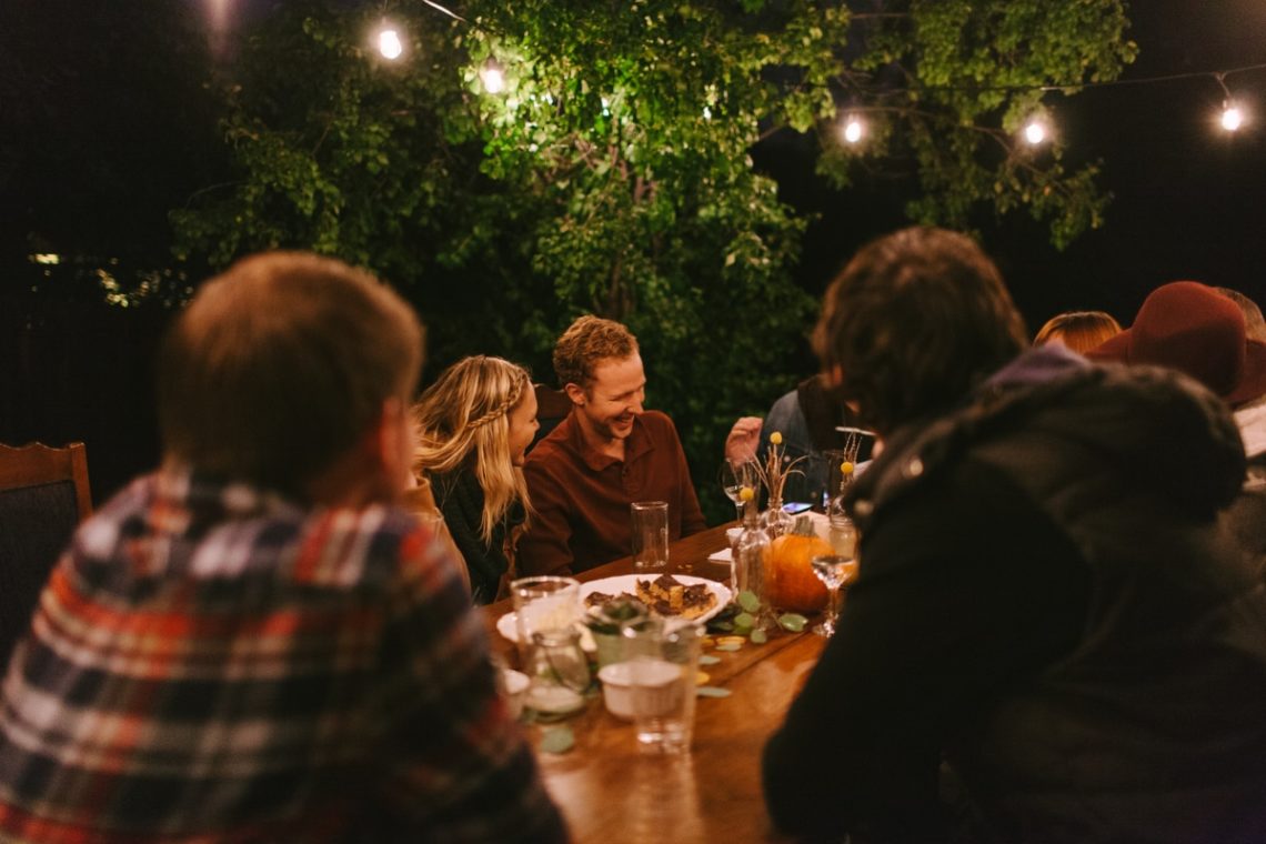 People sharing meal outdoors