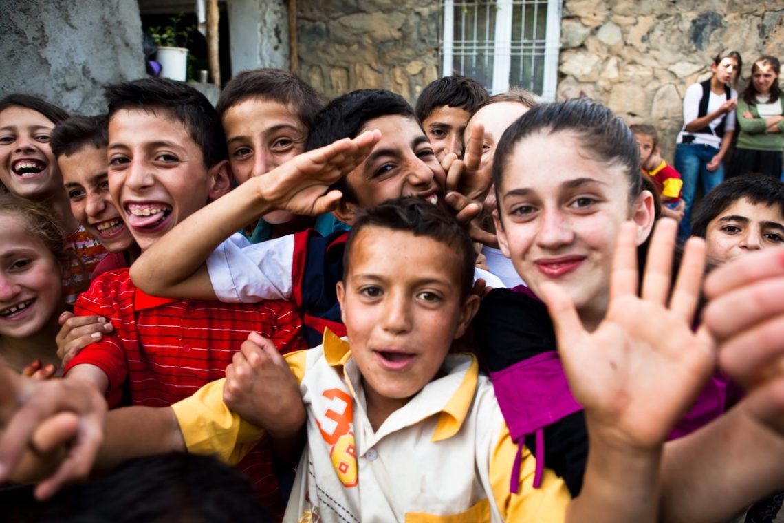 Group of happy Kurdish village kids